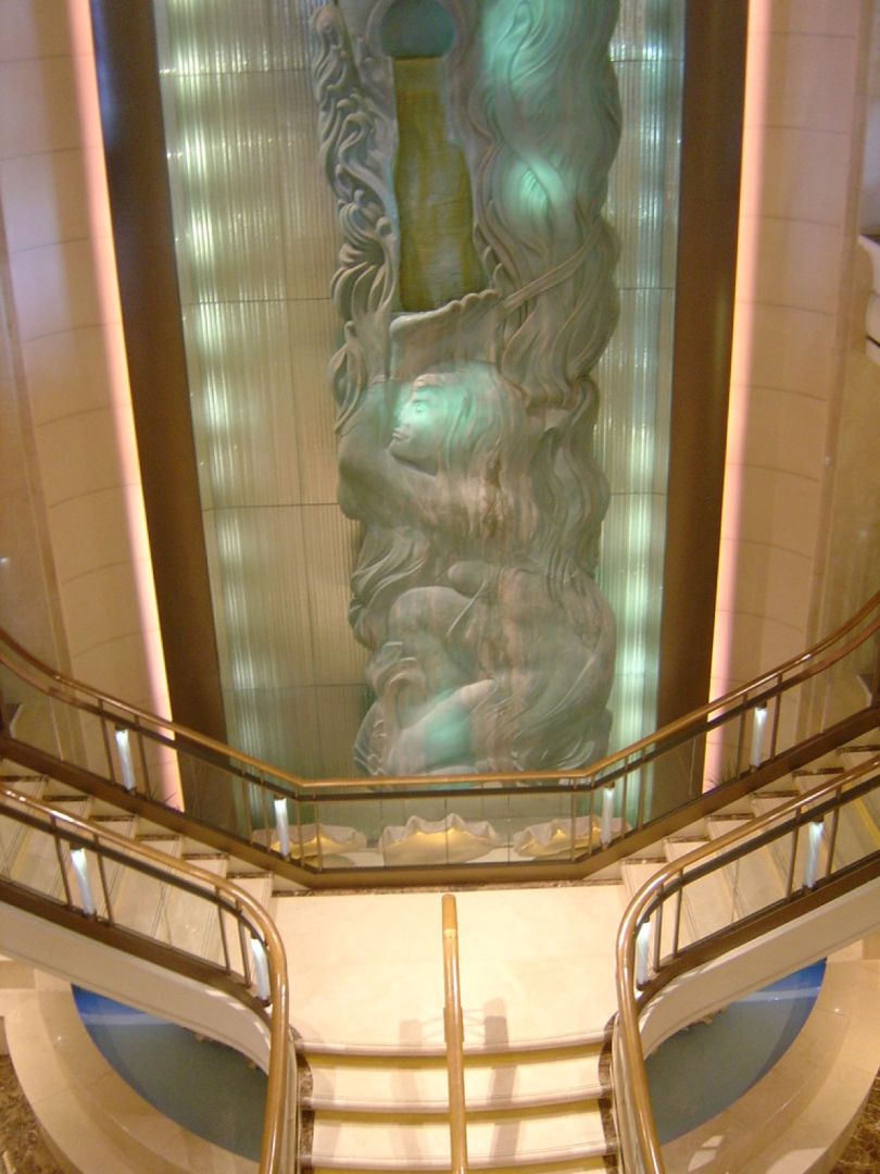 The multi-storey central atrium inside a large ocean cruise ship.