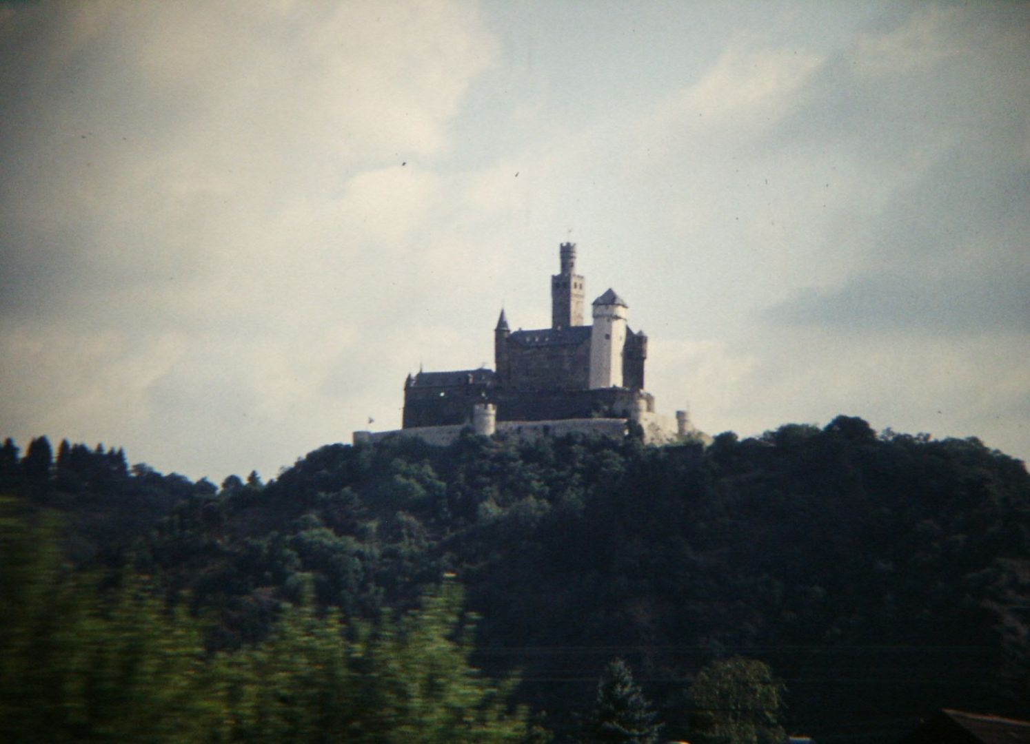 Marksburg Castle standing above the vineyards of the Middle Rhine valley.